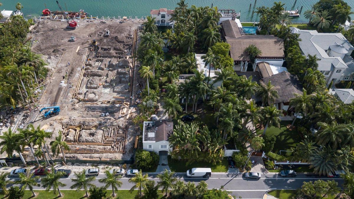 The property owner intends to tear down the former waterfront home of gangster Al Capone on Palm Island, pictured adjacent to the vacant lot.