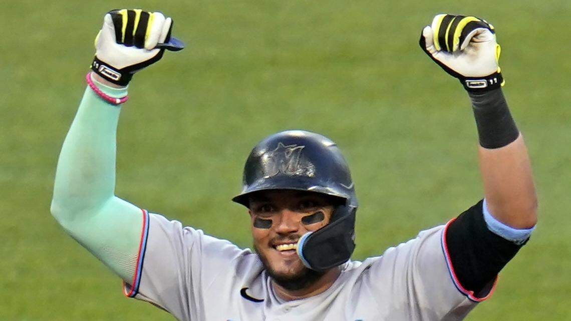 Miami Marlins’ Miguel Rojas celebrates as he stands on second base after driving in a run with a double off Pittsburgh Pirates starting pitcher Zach Thompson during the fourth inning of a baseball game in Pittsburgh, Friday, July 22, 2022.