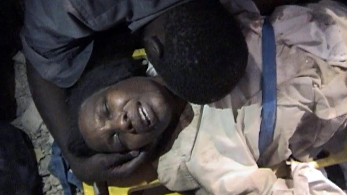 When the Jan. 12, 2010, earthquake struck, Ginette Sainfort got trapped for days under a mountain of debris in the underground parking garage of what had been a three-story bank building. Here she is in a video image right after her rescue in Port-au-Prince.