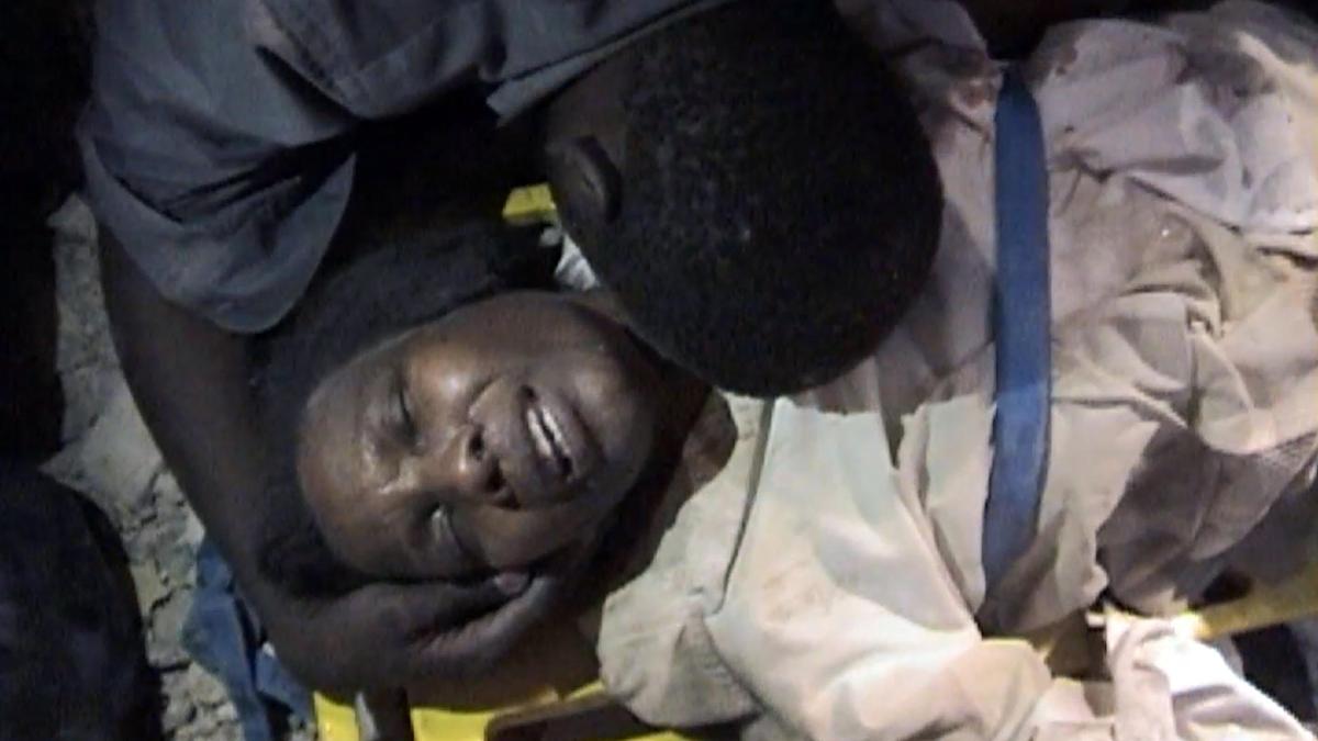 When the Jan. 12, 2010, earthquake struck, Ginette Sainfort got trapped for days under a mountain of debris in the underground parking garage of what had been a three-story bank building. Here she is in a video image right after her rescue in Port-au-Prince.