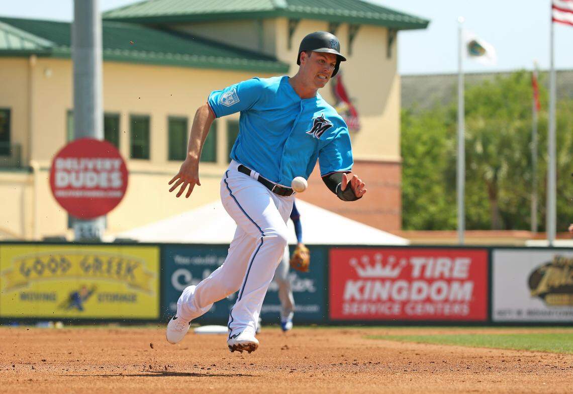 Miami Marlins third baseman Brian Anderson (15) runs into third base as he is out during the first inning of a Major League Baseball spring training game against the New York Mets at the Roger Dean Chevrolet Stadium on Tuesday, March 12, 2019 in Jupiter, FL.