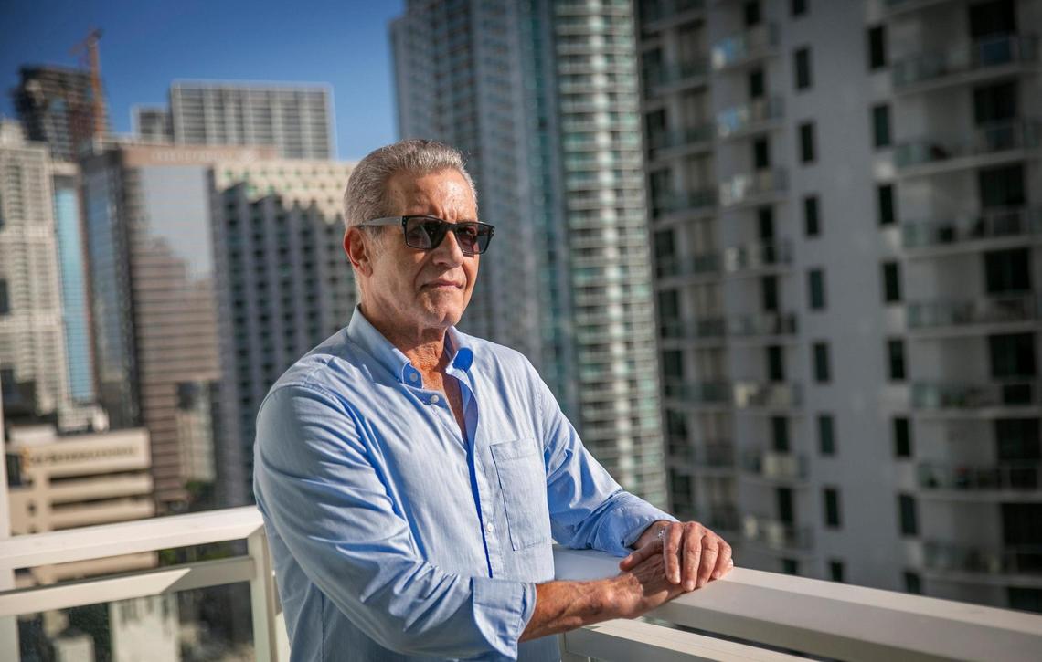 Steve Rosenthal, a survivor of the partial collapse of Champlain Towers South in Surfside, stands on the balcony of a condo he’s renting in the Brickell area. Aside from a few items he was able to throw into a small bag, Rosenthal lost his home and everything in it.