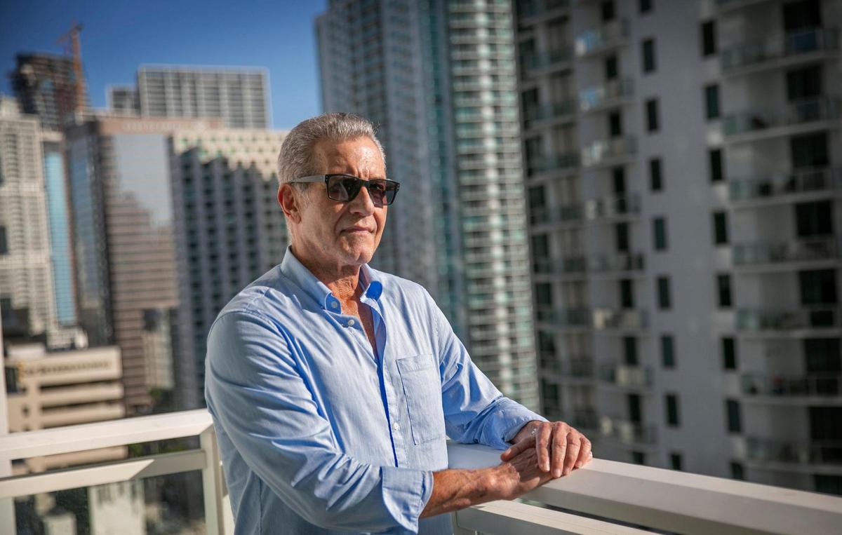 Steve Rosenthal, survivor of the partial collapse of Champlain Towers South in Surfside, stands on the balcony of a condo he’s renting in the Brickell area.