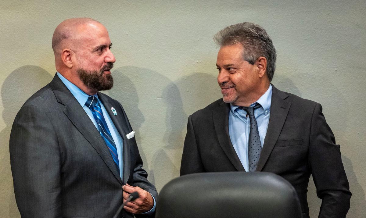 Miami City Commissioners Damian Pardo and Miguel Angel Gabela talk before the start of a Miami City Commission meeting on May 23, 2024.