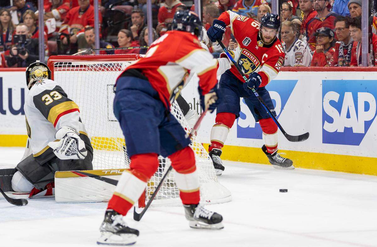 Florida Panthers center Aleksander Barkov (16) passes to left wing Anthony Duclair (10) as Vegas Golden Knights goaltender Adin Hill (33) defends his goal post in the first period of Game 4 of the NHL Stanley Cup Final at the FLA Live Arena on Saturday, June 10, 2023, in Sunrise, Fla.