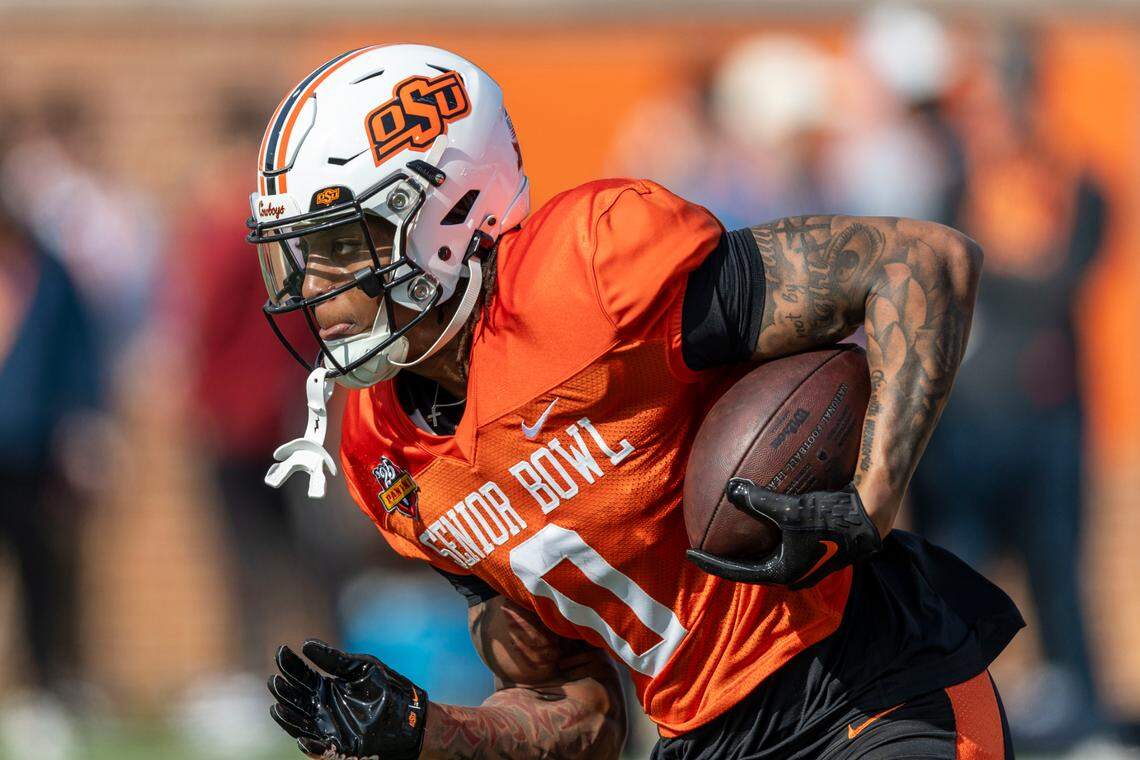 Jan 29, 2025; Mobile, AL, USA; National team running back Ollie Gordon II of Oklahoma State (0) runs the ball during Senior Bowl practice for the National team at Hancock Whitney Stadium.