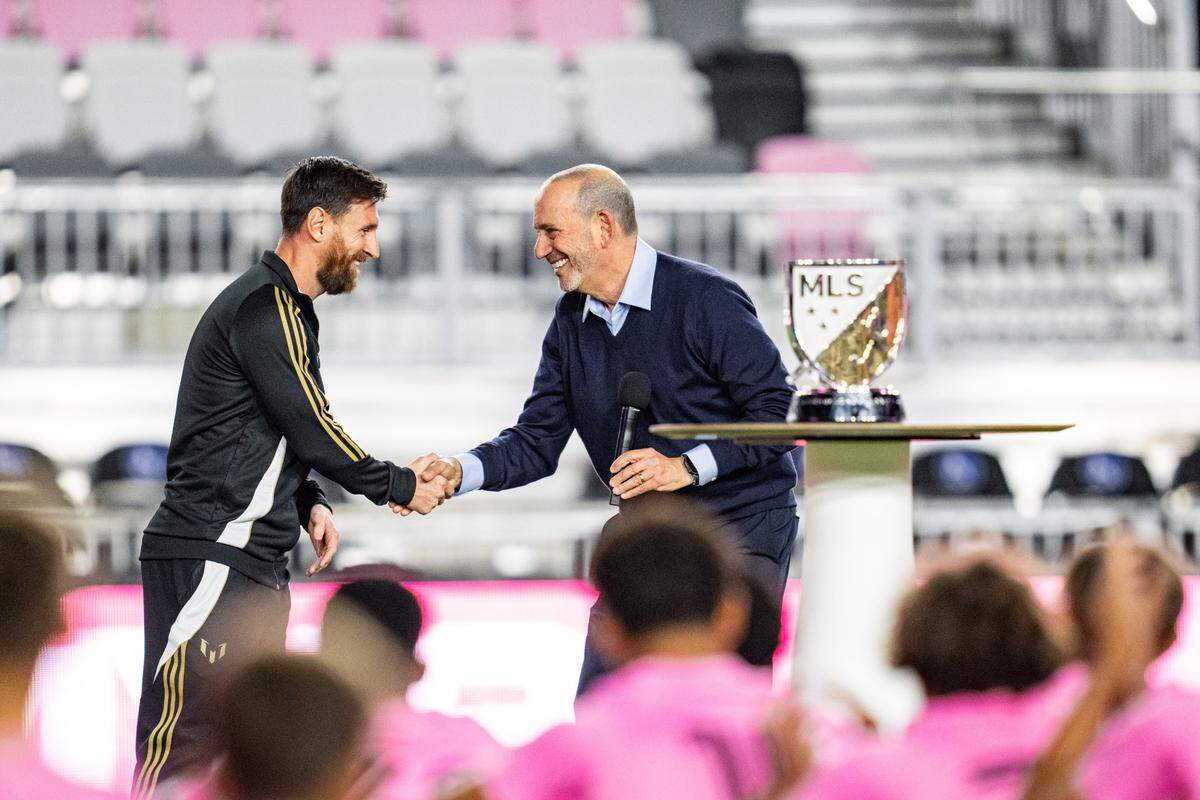MLS Commissioner Don Garber presents the 2024 MLS MVP trophy to Lionel Messi at Chase Stadium
