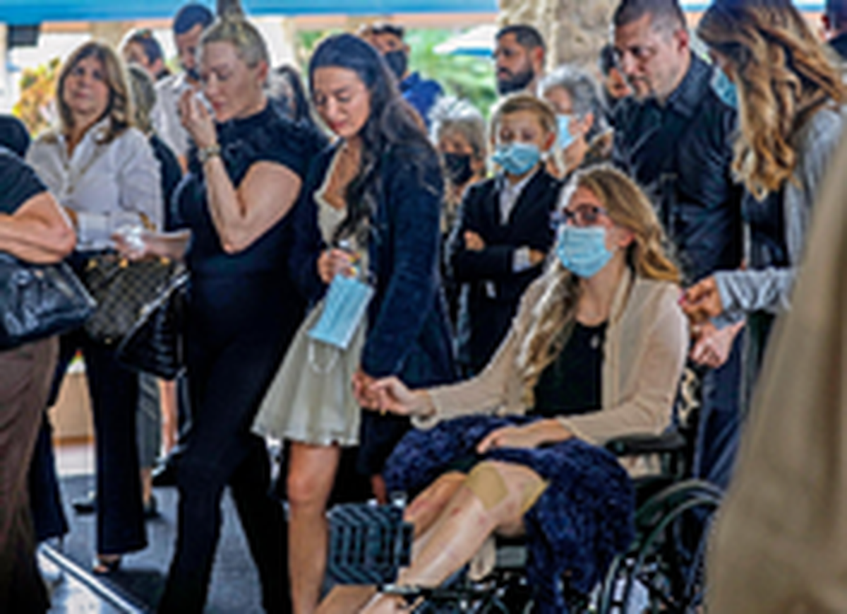 Tayler Scheinhaus, holding the hand of her half-sister, Deven Gonzalez, arrive for the funeral of Edgar Gonzalez at Christ Fellowship Church in Palmetto Bay on July 23, 2021.