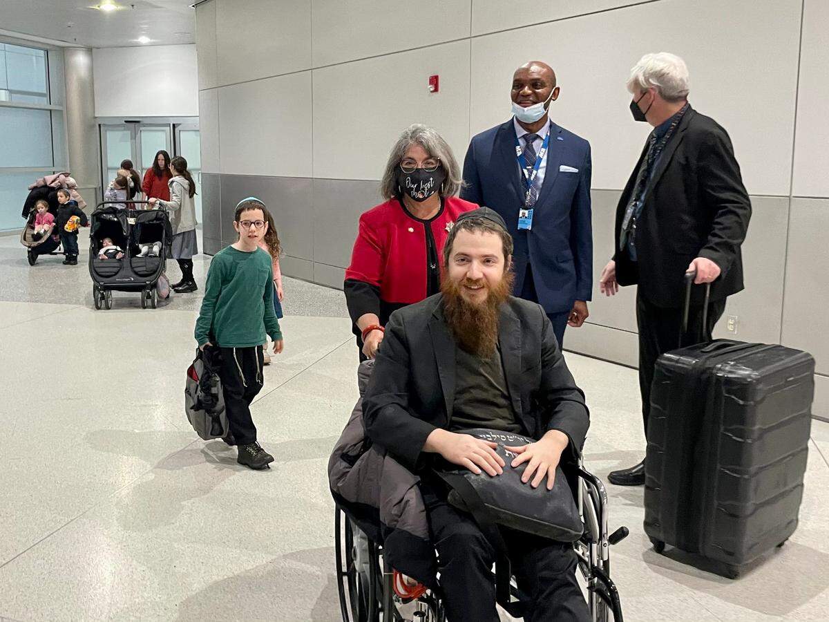Miami-Dade Mayor Daniella Levine Cava greets Rabbi Yisroel Silberstein and his family at Miami International Airport on Tuesday, March 8, 2022, after they escaped from Ukraine during Russia’s invasion.