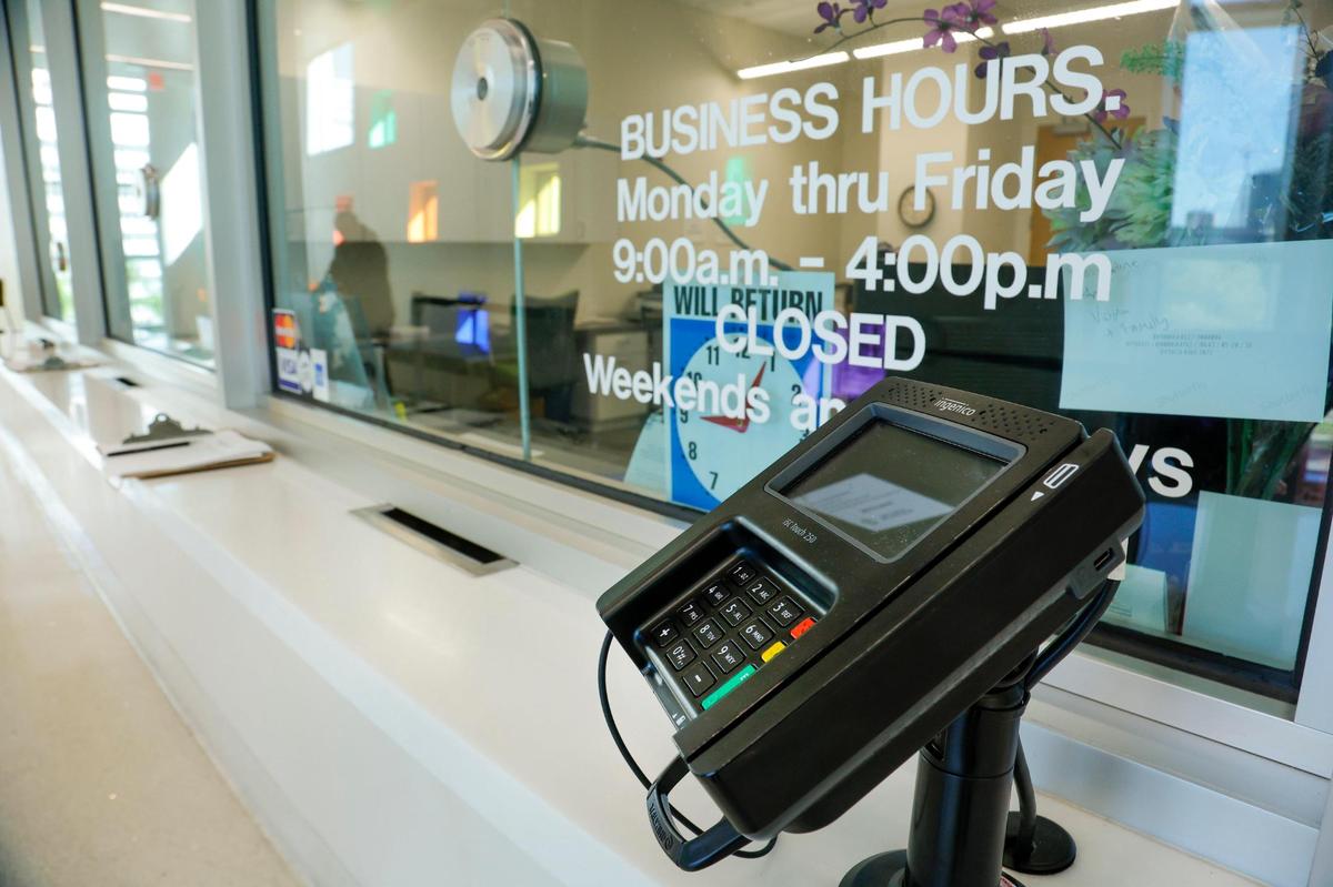 A card reader machine to pay court is positioned at the Miami-Dade County Clerk of Court office inside the children’s courthouse in downtown Miami on Monday, Feb 13, 2023.