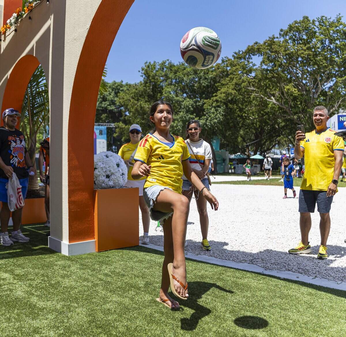 Sofia Tamayo, 12, kicks a soccer ball as she visits the FIFA Fan Festival Miami with her family at Bayfront Park on Saturday, June 13, 2026, in downtown Miami, Fla.