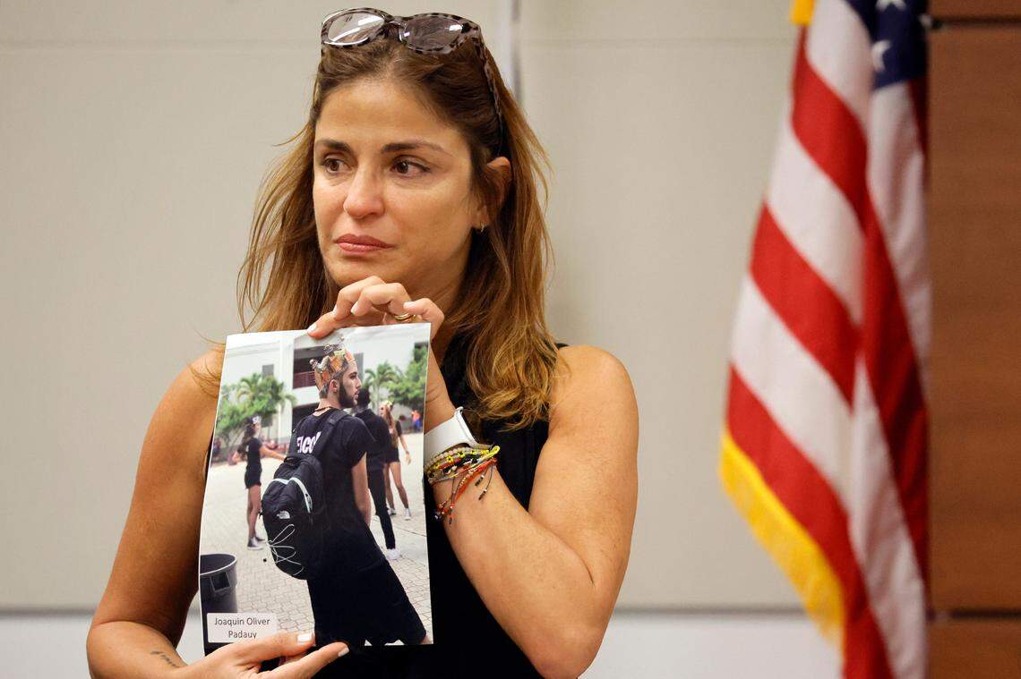 Patricia Oliver holds a photograph of her son, Joaquin Oliver, before giving her victim impact statement during the sentencing trial of Parkland shooter Nikolas Cruz.