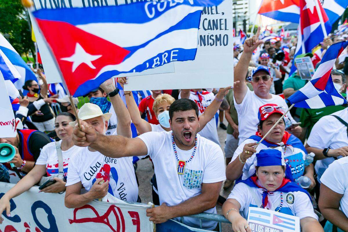 Activists participate in a rally at Bayfront Park in downtown Miami on Saturday, July 31, 2021. The rally was held in solidarity with the anti-government protests happening in Cuba.