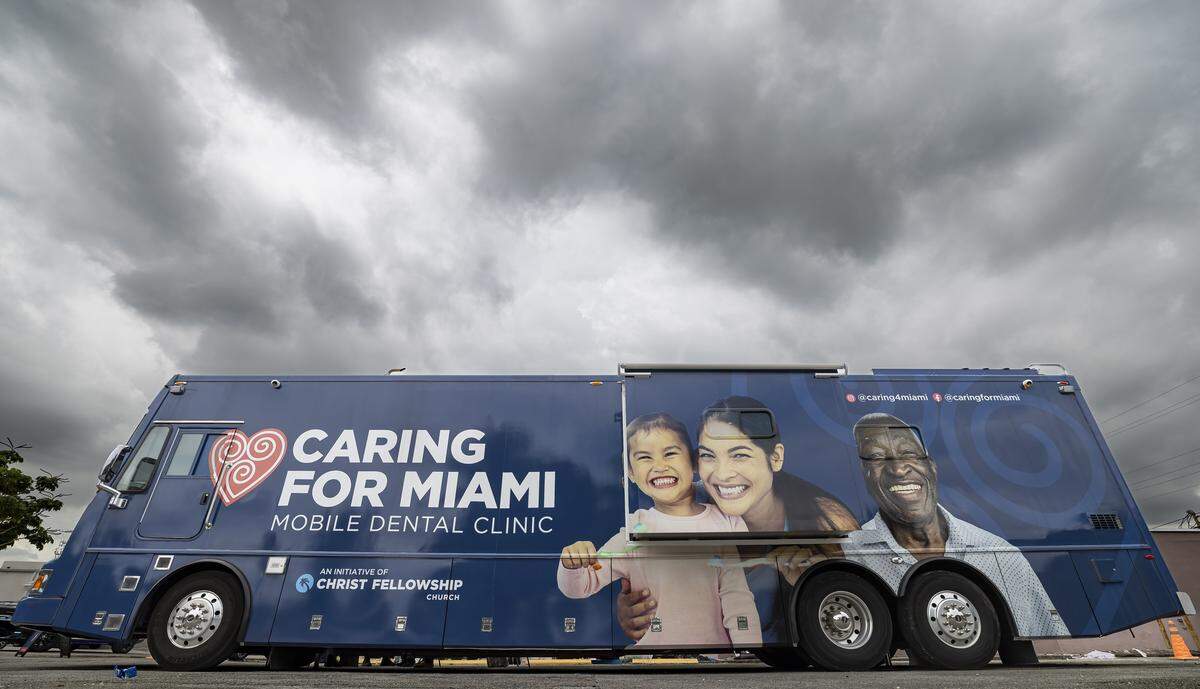 A view of Caring for Miami’s Mobile Dental Clinic as staff prepares to receive patients on Thursday, Sept. 4, 2025, in Opa-locka, Fla. Caring for Miami is providing free dental care aboard the clinic for uninsured and underserved residents.