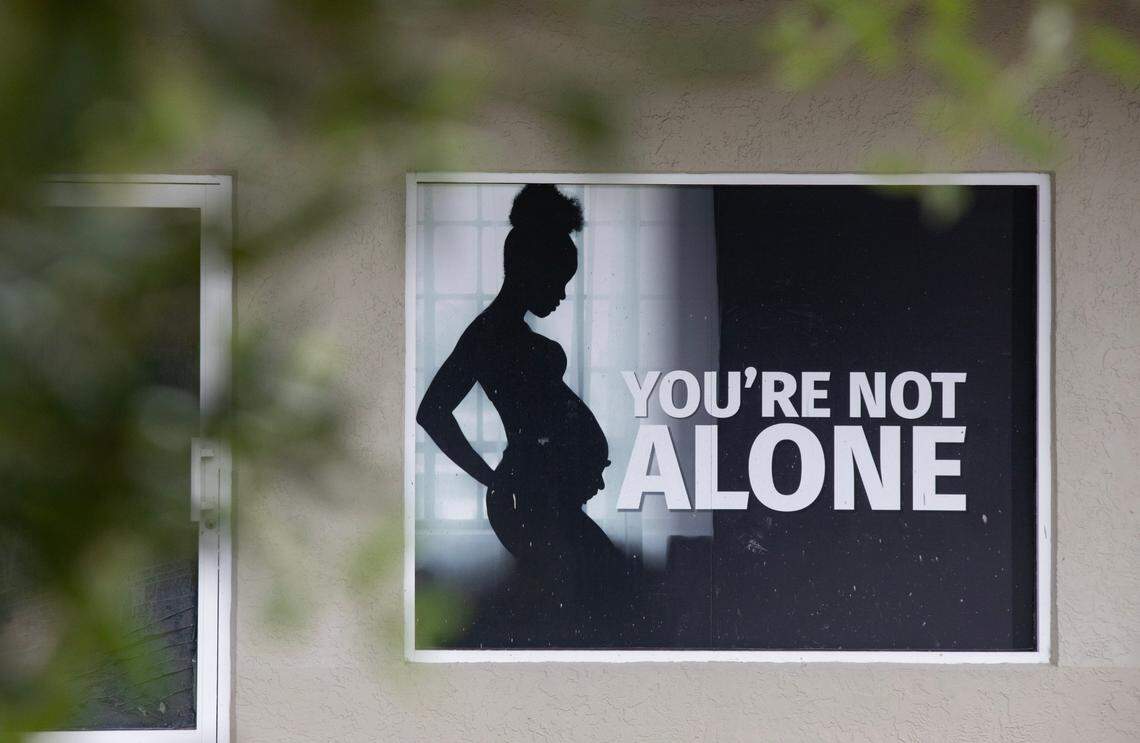 A sign posted in a window at Mary’s Pregnancy Resource Center.