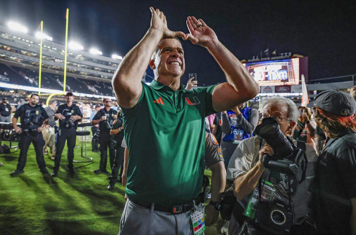 Miami Hurricanes head coach Mario Cristobal flashes the ‘U’ sign after the Hurricanes defeat the Florida State Seminoles during their NCAA game at Doak Campbell Stadium in Tallahassee, Florida, on Saturday, October 4, 2025.