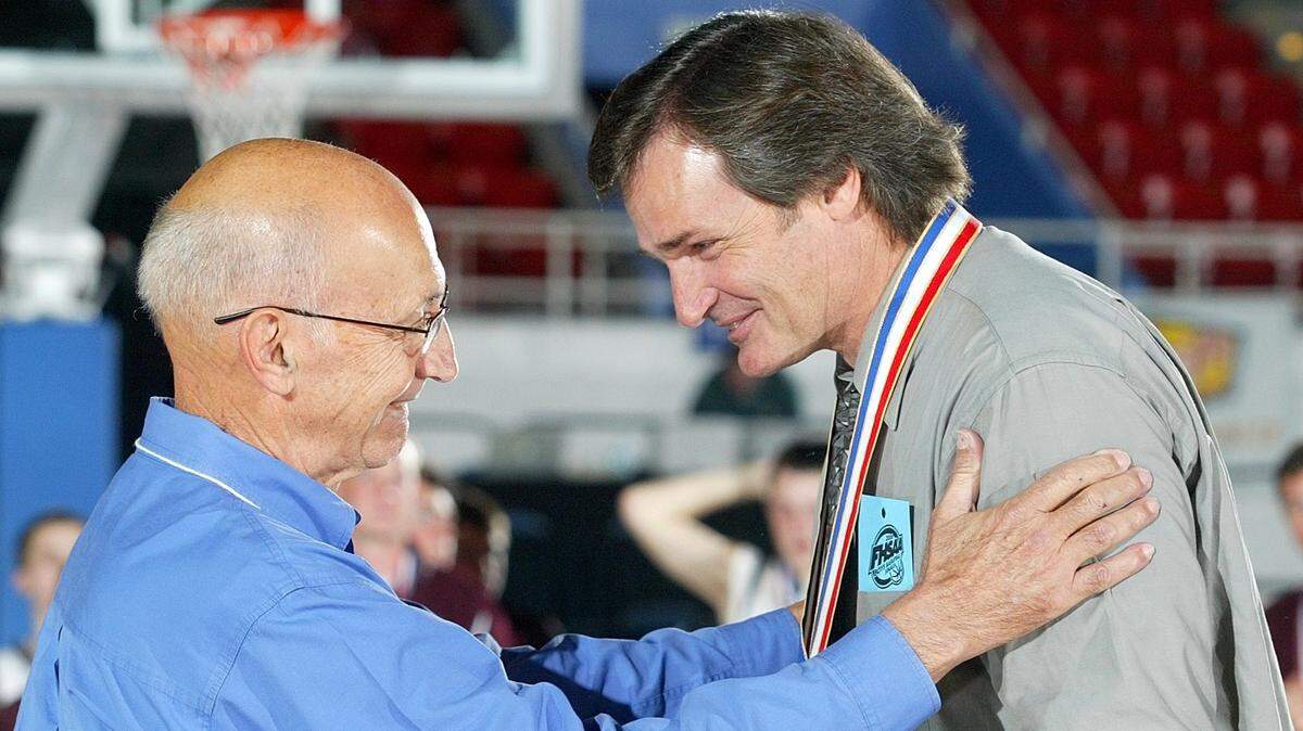 SPECIAL TO THE MIAMI HERALD, AUTH. EDITOR: JOSE IGLESIAS- LAKELAND, FL--Calusa Prep Coach Tim Fowler, right, is congratulated by his father, Linton Fowler, who had just put a first-place medal around his neck after the Colts beat Lake Mary Prep in their boys state basketball Class 1A championship game 79-65. (FOR ANDRE FERNANDEZ SIDEBAR).