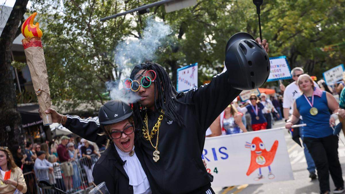 Playing the roles of Martha Stewart and Snoop Dog, Susan Kinder, left, and Rafael Mayfield, right, along with their troupe of satirists poke fun of the Summer Olympics.