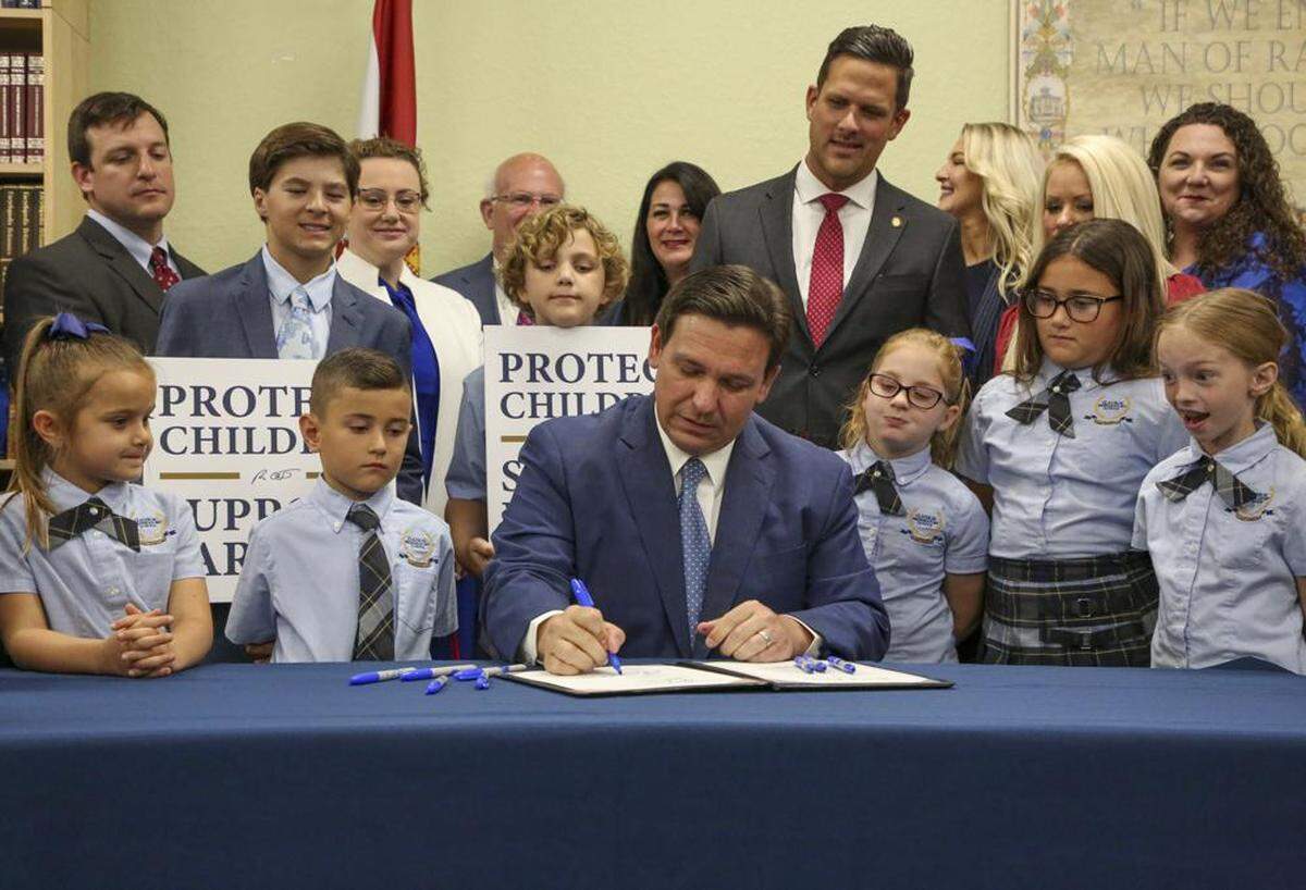 In March 2022, Florida Gov. Ron DeSantis signs the Parental Rights in Education bill at Classical Preparatory school in Shady Hills, Florida.