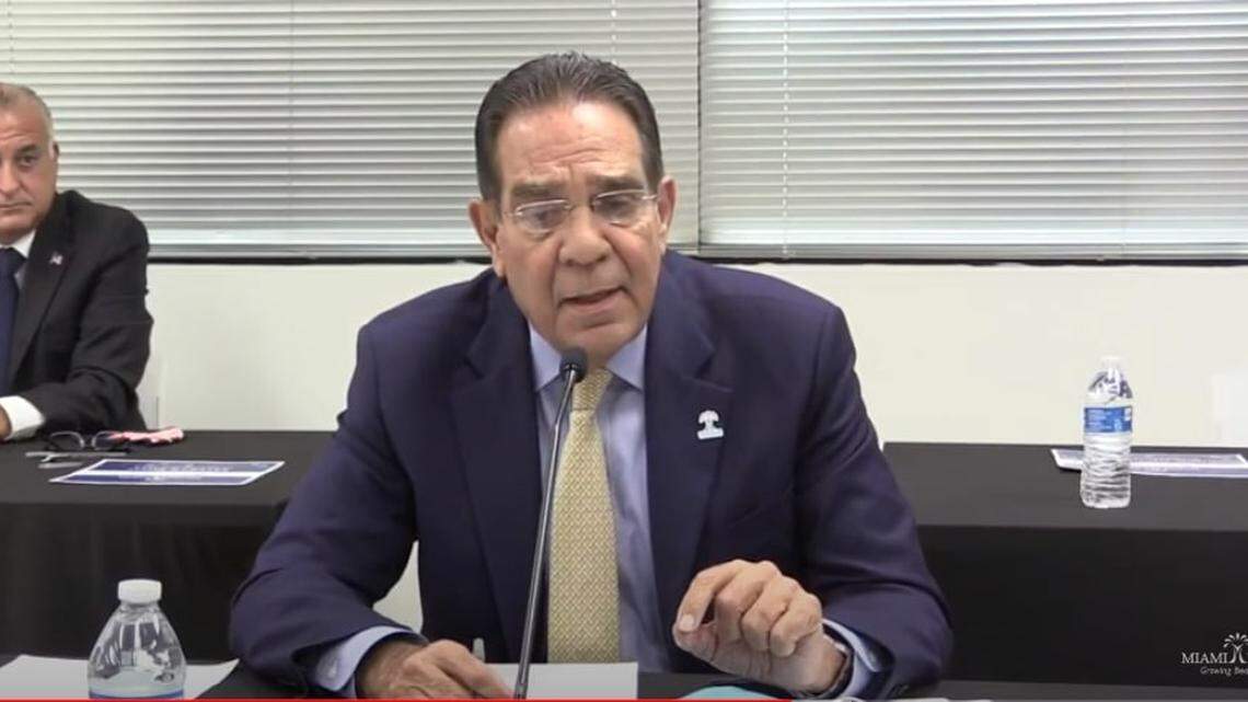 Miami-Dade Commissioner Xavier Suarez answers a question on Friday, July 17, 2020, during a debate organized by Miami Lakes for the candidates running for county mayor in 2020. Behind is Esteban “Steve” Bovo, another commissioner running for mayor.
