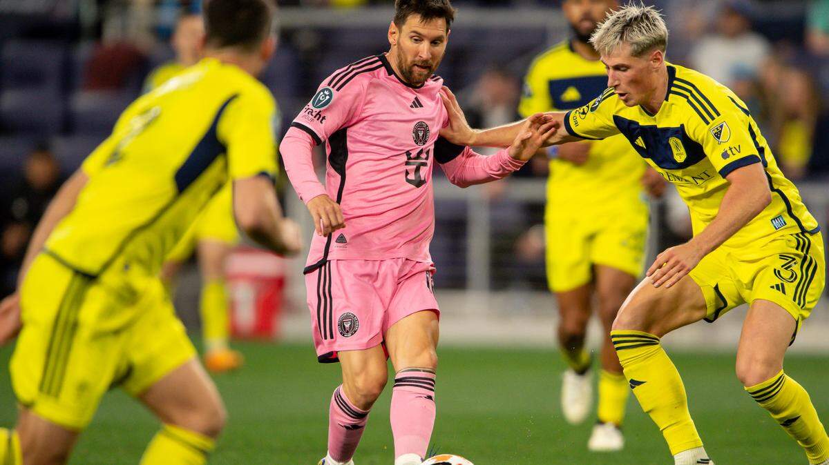 Mar 7, 2024; Nashville, TN, USA; Inter Miami forward Lionel Messi (10) dribbles against the Nashville SC during the second half at GEODIS Park. Mandatory Credit: Steve Roberts-USA TODAY Sports
