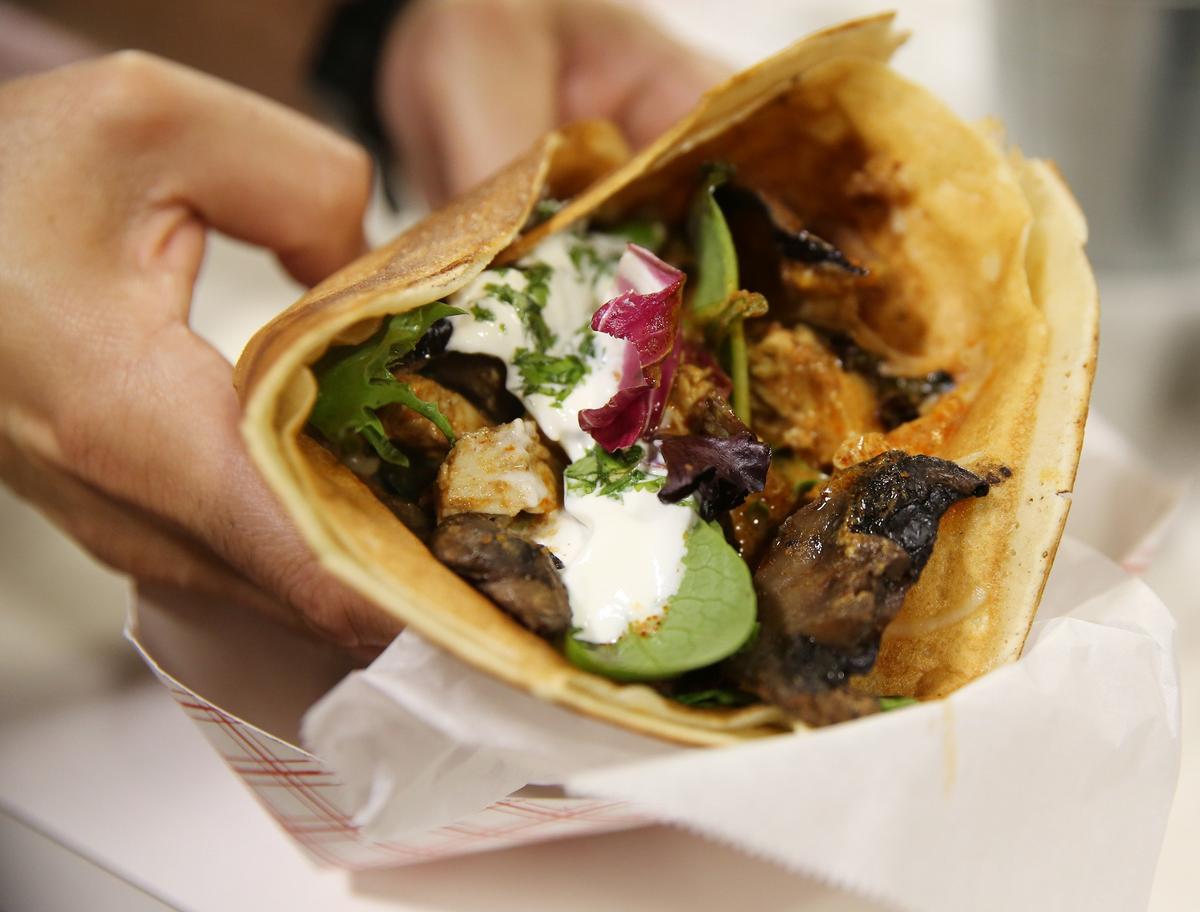 The Chicken tikka masala crepe takes the classic crepe and stuffs it with mozzarella cheese, fried eggplant, marinated mushrooms, a dollop of yogurt and a creamy, spicy chicken tikka masala. The cost is $8.50 and can be found at #737.