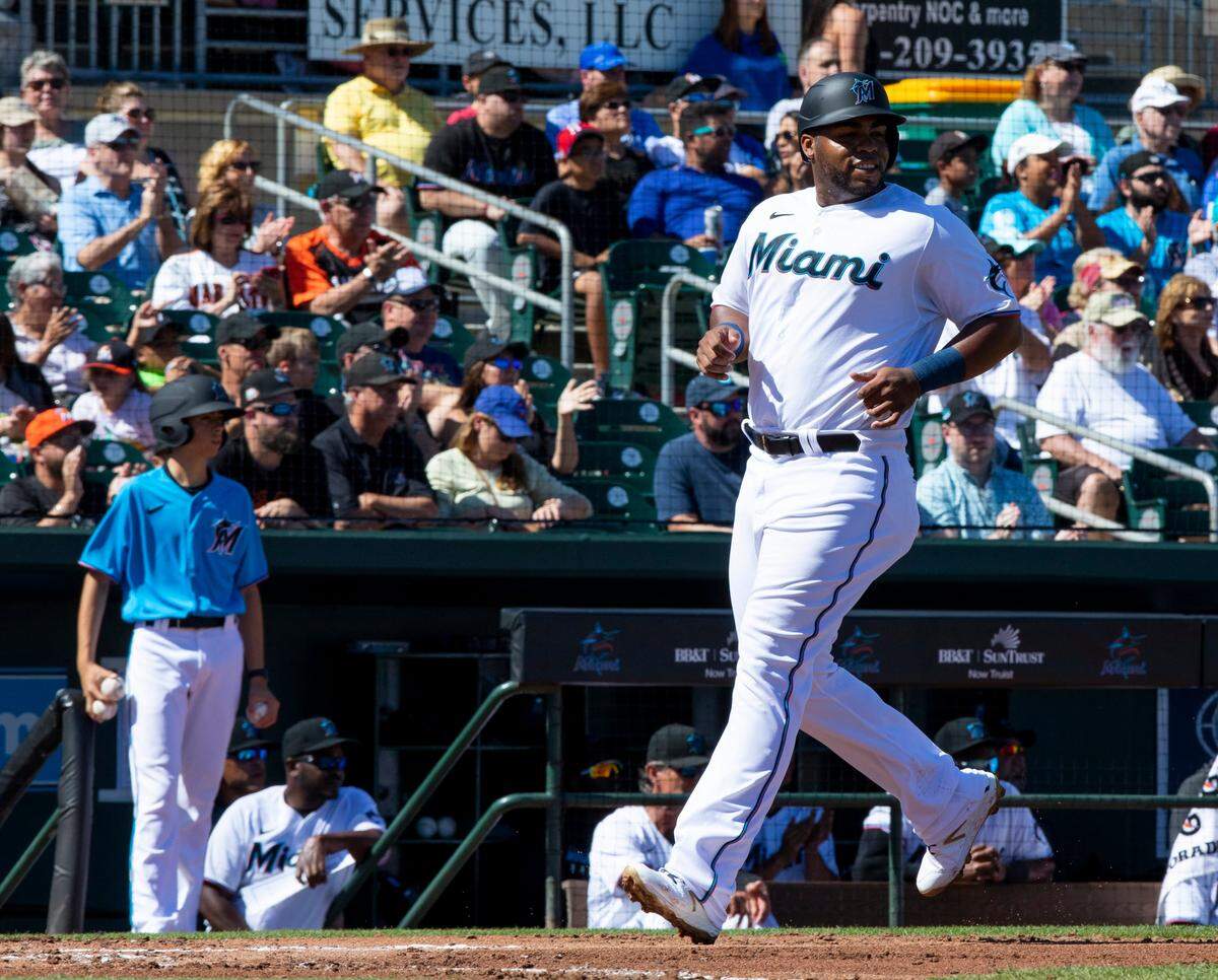 Miami Marlins first baseman Jesus Aguilar (24) crosses home plate during the second inning of a Spring Training game against the Washington Nationals at Roger Dean Chevrolet Stadium in Jupiter, Florida on Sunday, February 23, 2020.