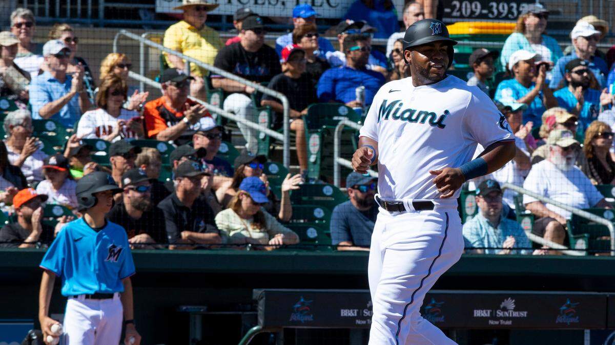 Miami Marlins first baseman Jesus Aguilar (24) crosses home plate during the second inning of a Spring Training game against the Washington Nationals at Roger Dean Chevrolet Stadium in Jupiter, Florida on Sunday, February 23, 2020.