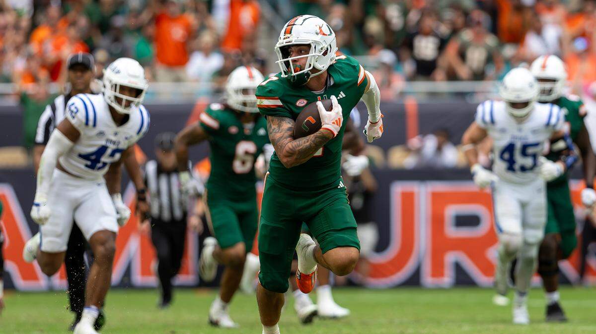 Miami Hurricanes wide receiver Xavier Restrepo (7) runs loose to scores a touchdown during the second half of an ACC football game against the Duke Blue Devils at Hard Rock Stadium on Saturday, Nov. 2, 2024, in Miami Gardens, Fla.