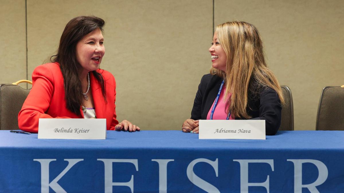 Belinda Keiser, left, and Adrianna Nava at the National Association of Hispanic Nurses Conference at the Hyatt Regency in Miami. A panel discussed how to retain nurses in Florida amid a national shortage.