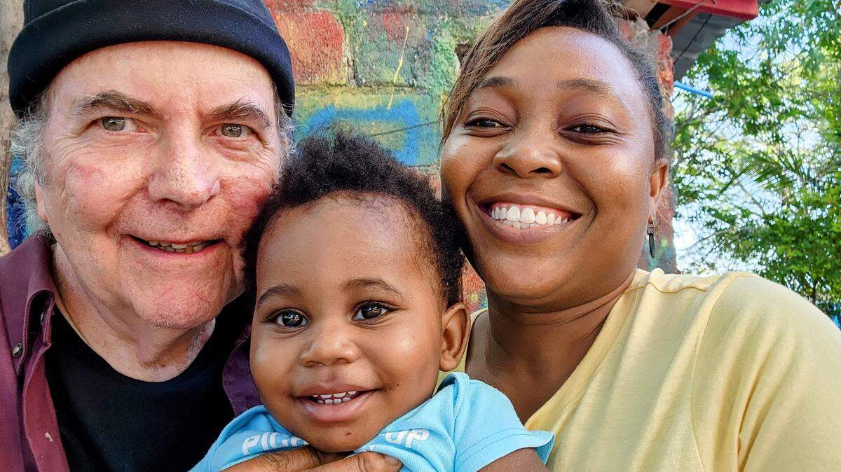 Gerard Straub and his wife, Dr. Stéphanie Jean-Louis Straub, at the orphanage they run in Port-au-Prince, Haiti, with Moïse, their two-year-old son. Straub assumed legal guardianship of Moïse after an elderly woman who had no relation to the boy dropped him off at his orphanage. 