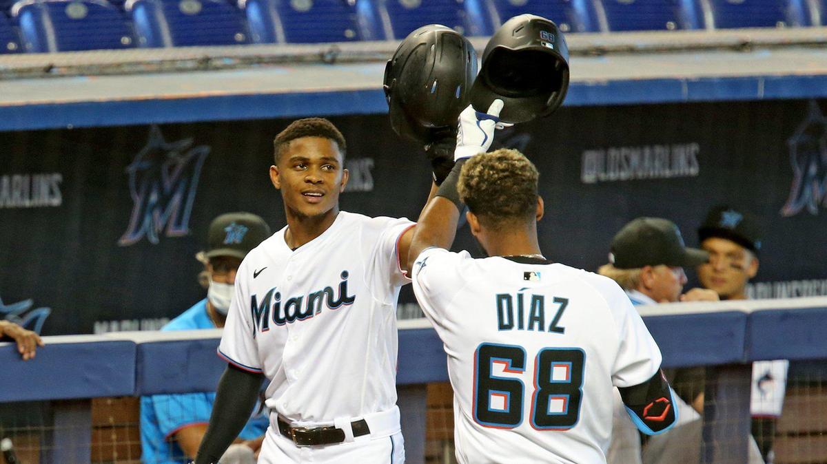 Miami Marlins Magneuris Sierra (34) hits helmets with Lewin Diaz (68) after Diaz hit a home run during a simulated game at Marlins Park, Miami, Florida, July 9, 2020.