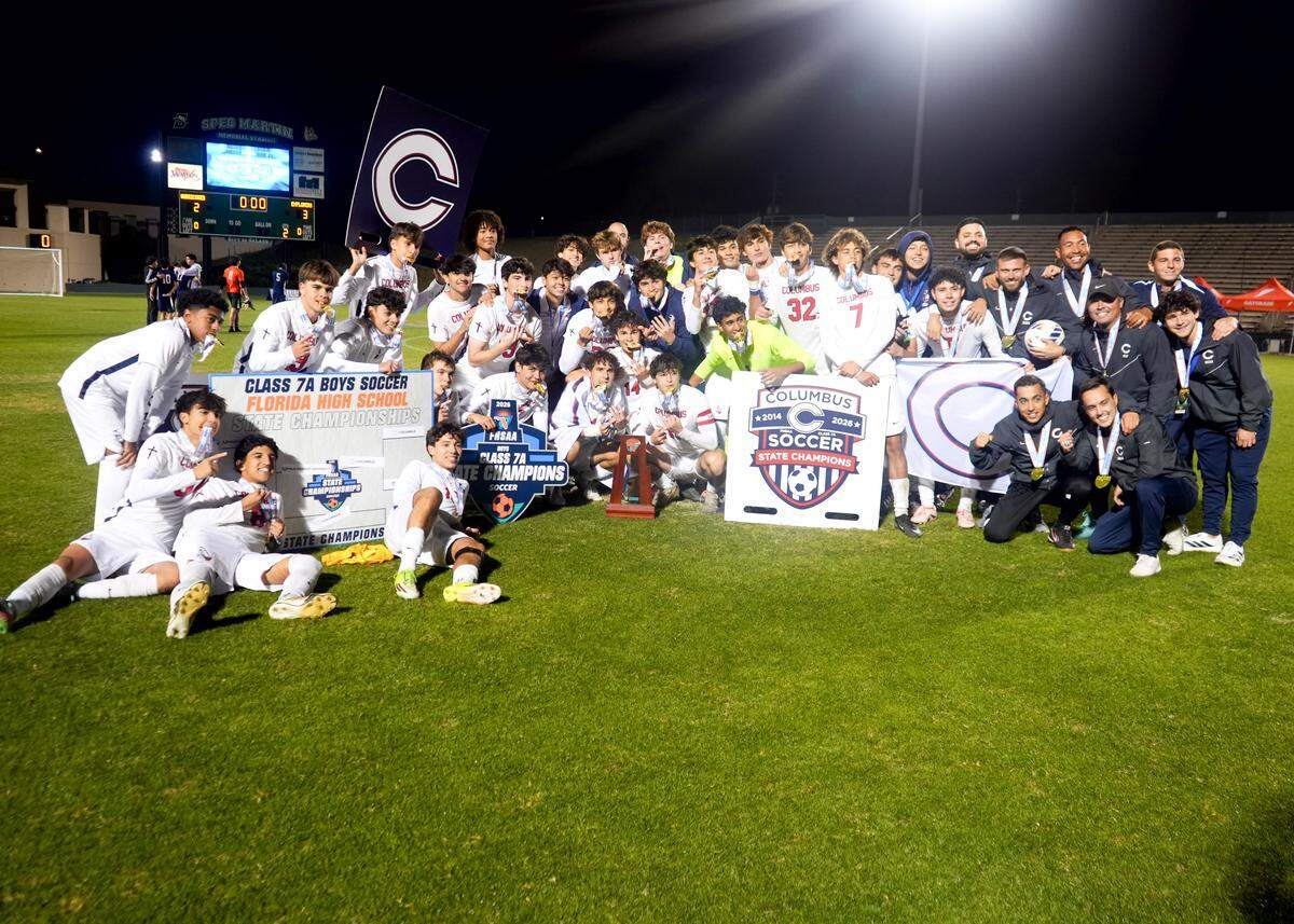 Columbus’ boys’ soccer team celebrates after winning the Class 7A state championship on Wednesday night at Spec Martin Stadium in DeLand, Fla.