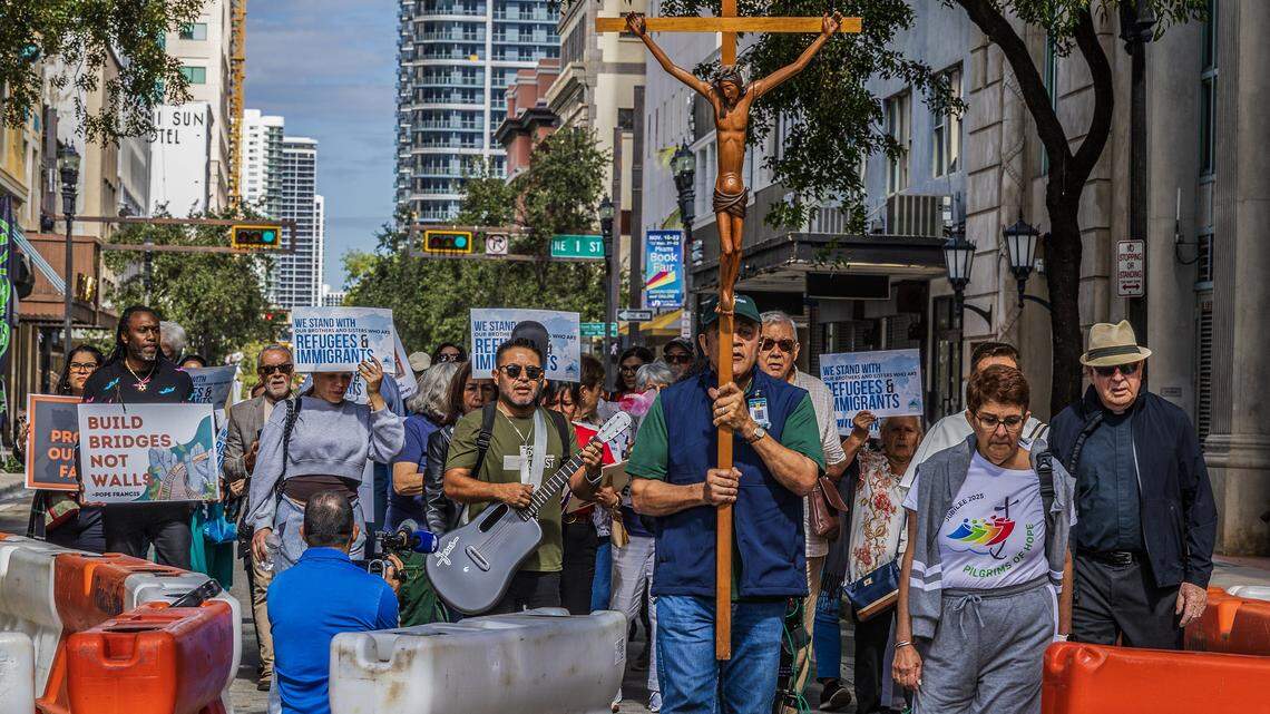 A group of immigrants advocates marched in a procession from the Gesu Catholic Church in downtown Miami to the EOIR Immigration Court, as part of the nationwide “One Church, One Family: Catholic Public Witness for Immigrants” campaign, on Thursday, November 13, 2025.