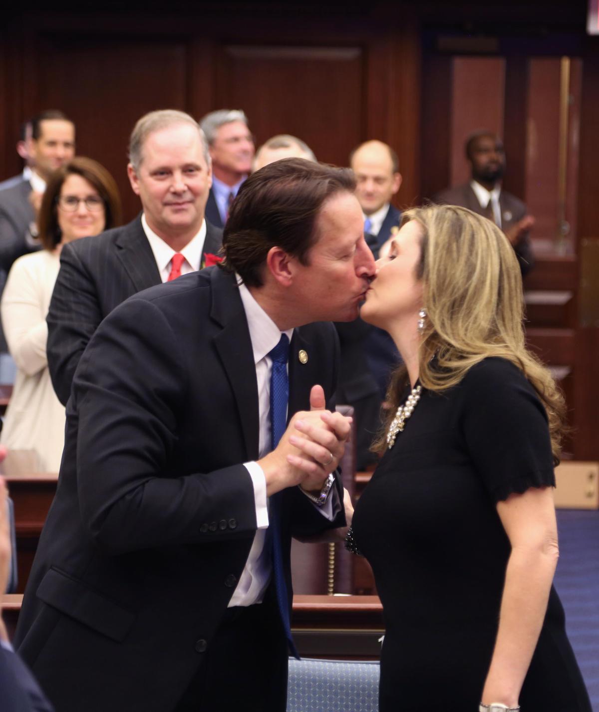 New Senate President Bill Galvano, R-Bradenton, kisses his wife, Julie, after he was sworn in Tuesday, Nov. 20, 2018, at the Florida Capitol in Tallahassee.