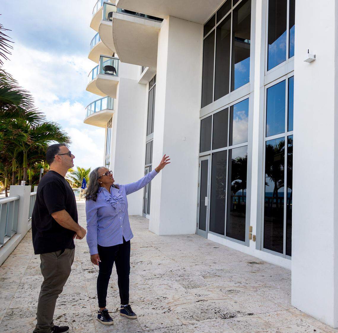 Lisa Gardner, president of the Marena’s condominium association, points to a sensor outside of the Marena’s Beach Resort on Jan. 19 that measures any vibrations to the building.