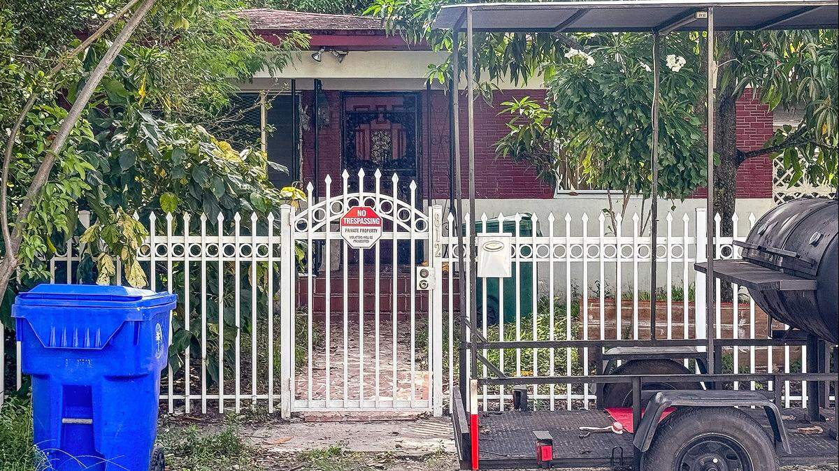The front of the house at 812 NW 67th St. in Miami, Fla., where police found a man’s body on the property on Sunday, Oct. 5, 2025. Miami-Dade Animal Services confiscated 11 dogs from the property Sunday as investigators are trying to determine how he died.
