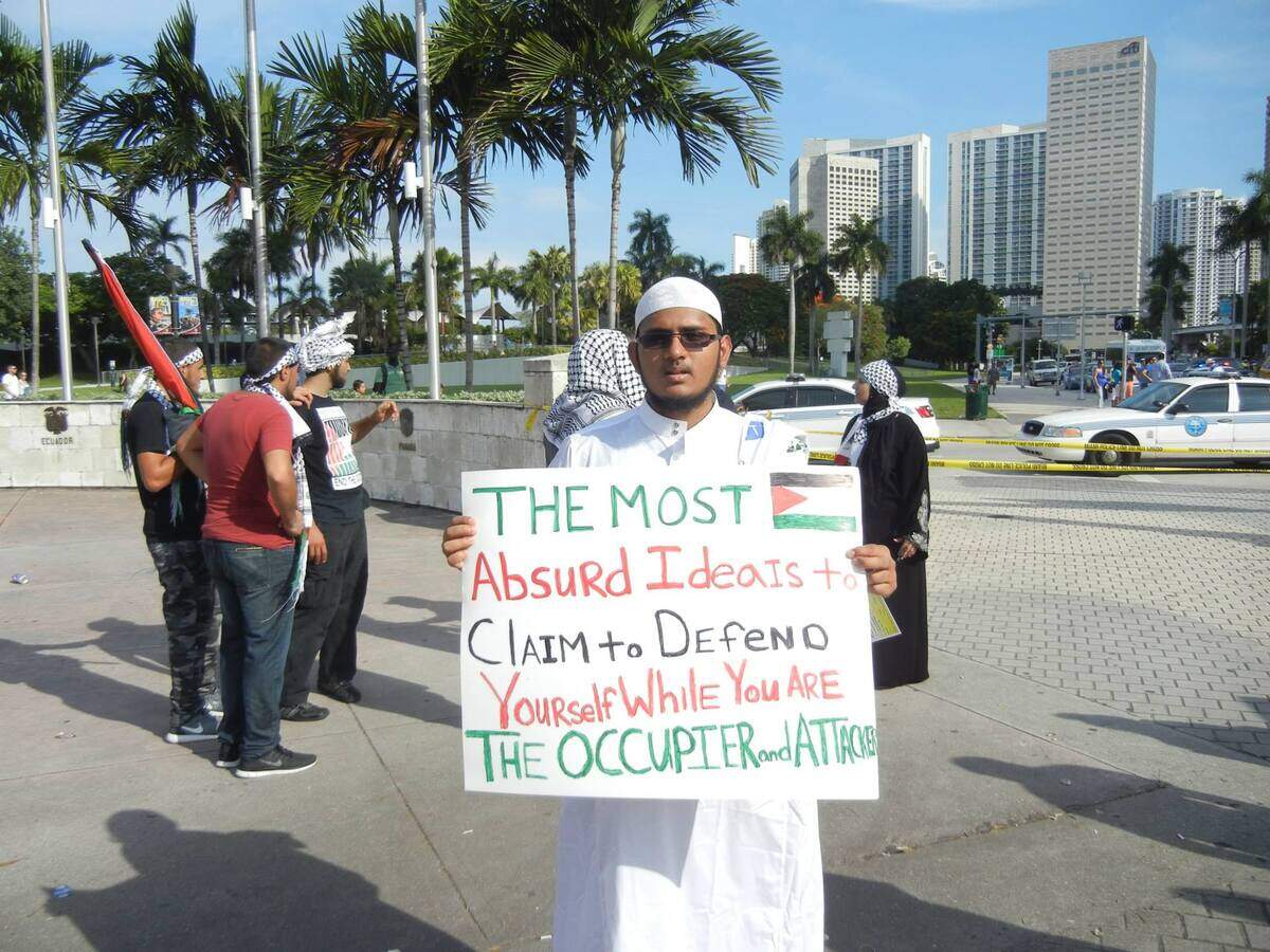 Salman Rashid, in a photo on Facebook, at a protest in Downtown Miami in 2014.