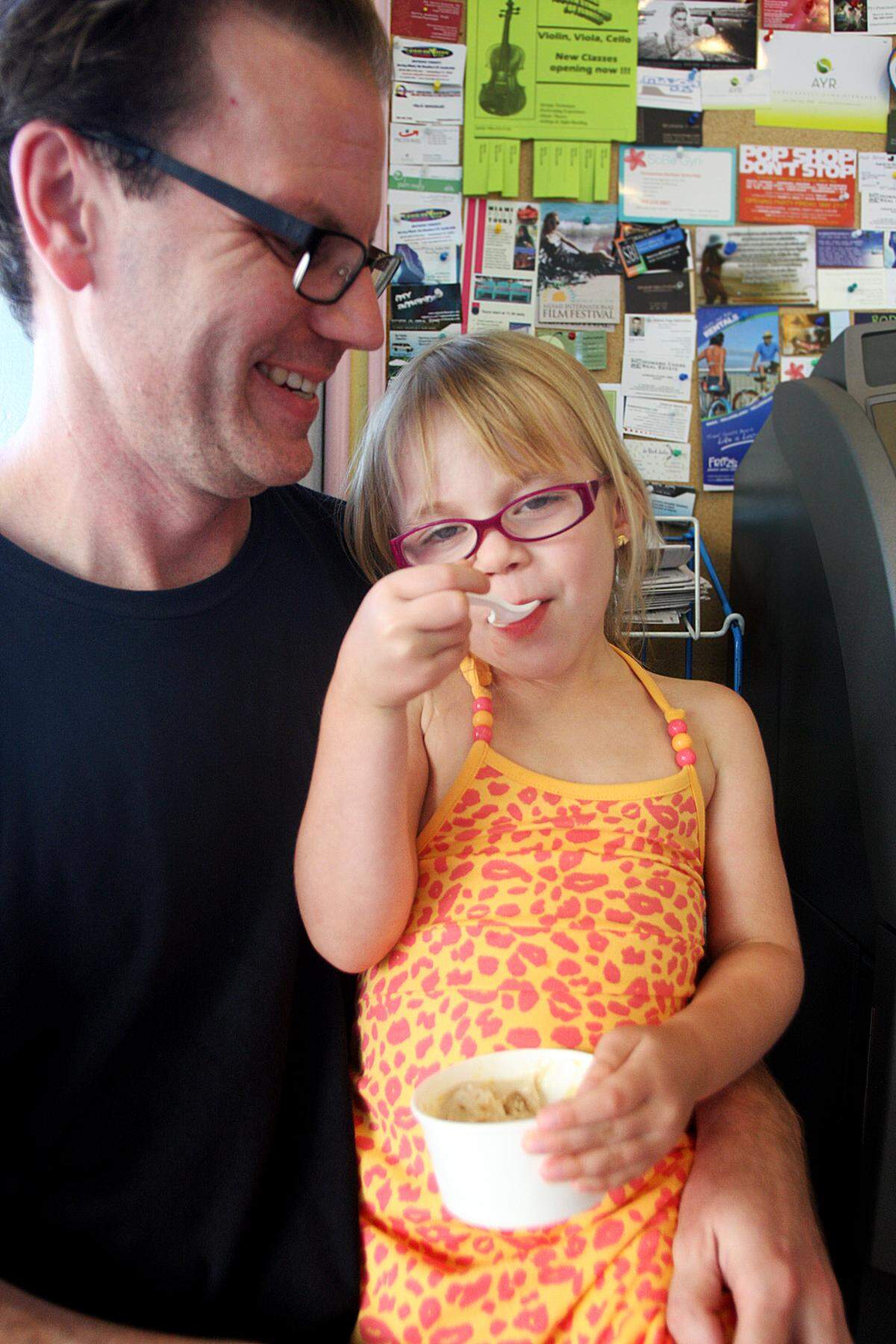 In this file photo from June 5, 2010, Clara, then age 4, had peanut butter ice cream while sitting on her dad Phil de Montmollin III's lap at the Frieze Ice Cream Factory on Miami Beach. He was a publicity director at Homestead-Miami Speedway. His father, Phil de Montmollin Jr., was a Miami Herald president in the 1980s.