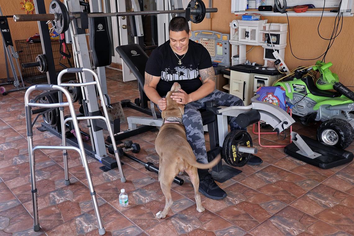Jonathan Cruz, who was severely injured in a boating accident, and year later to the day while rehabilitating from massive injuries, his family has been dealt another blow - their young son was diagnosed with Leukemia. Cruz plays with his dog, “Luna.”