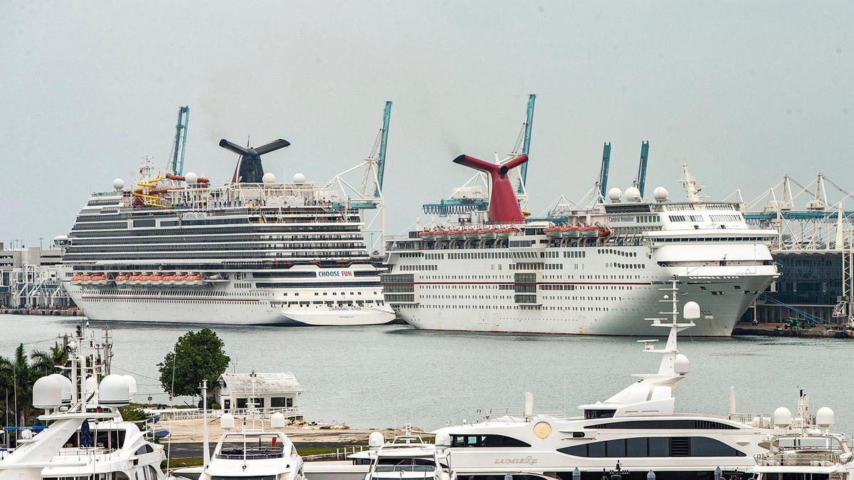 Cruise Ships Carnival Vista, left, and Carnival Sensation from Carnival Cruise Line, are seen docked at PortMiami after the CDC released a new phase of the Framework for Conditional Sailing Order for cruise ships operating or seeking to operate in U.S. waters, on Wednesday, April 21, 2021.
