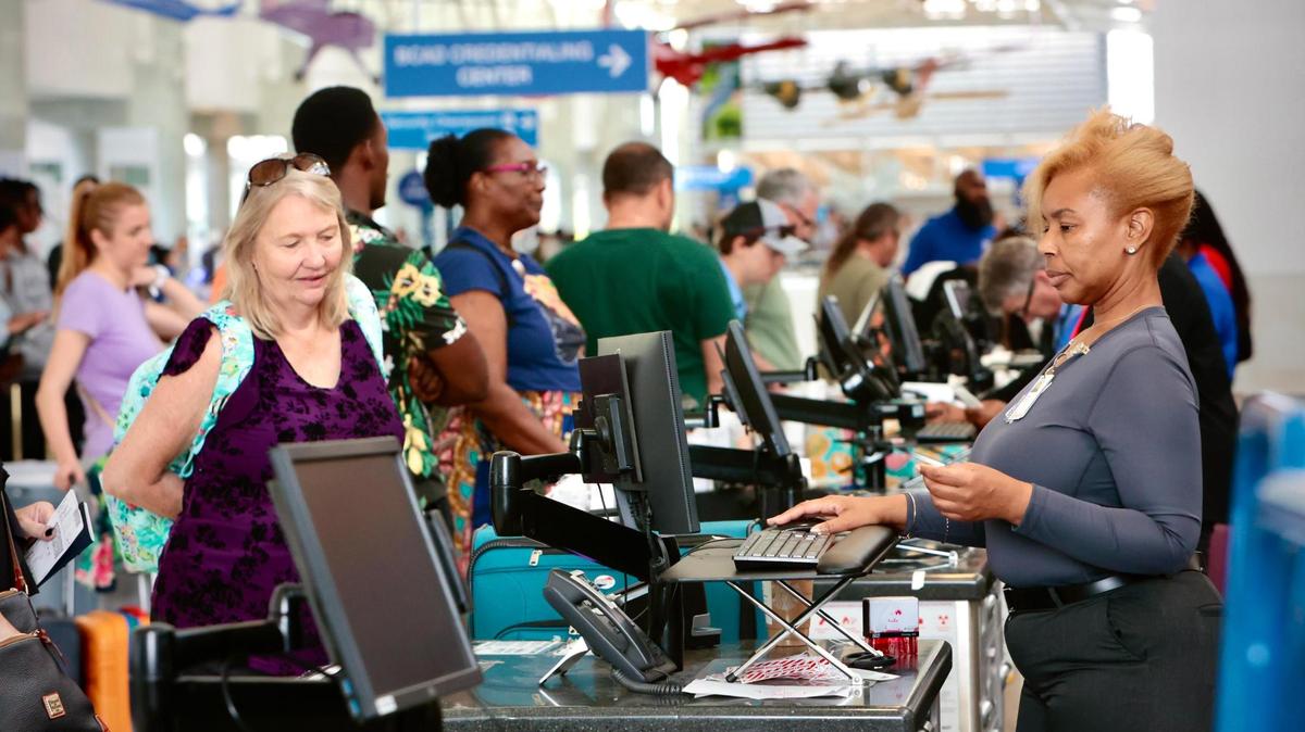 Passengers check in at the South West Airlines counter at the Fort Lauderdale-Hollywood International Airport on Friday, April 14, 2023.
