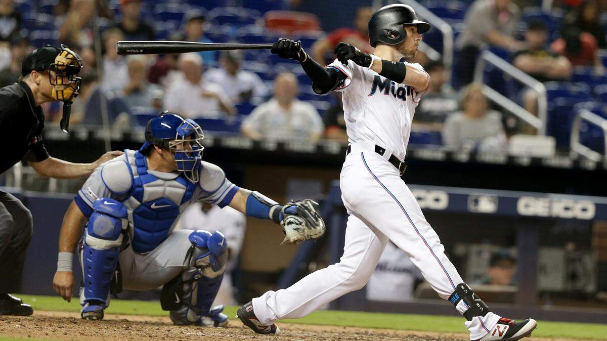 Miami Marlins infielder J.T. Riddle hits a single in the seventh inning of the Miami Marlins vs New York Mets, game at the Marlins Park in Little Havana in Miami on Tuesday April 02, 2019.