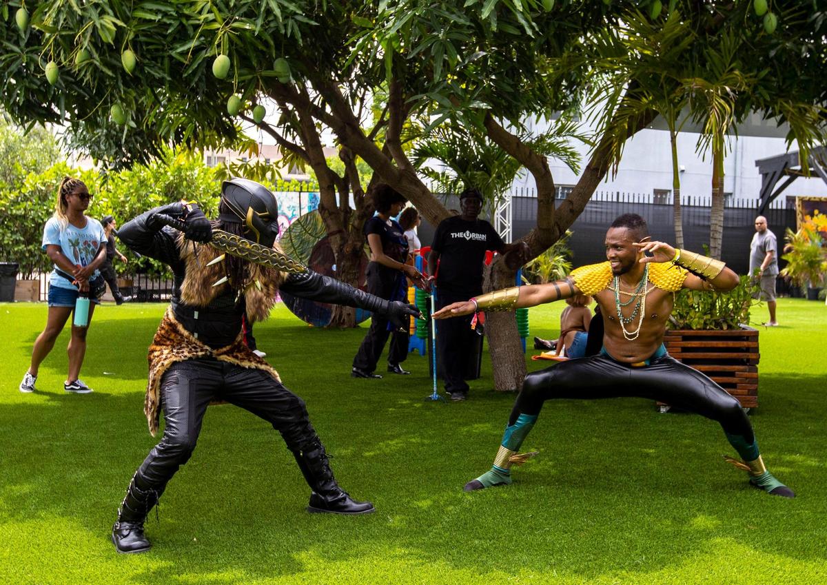 Atlanta-based cosplayers crew, Beltline Cosplay, entertains the crowds during AFROPUNK music festival at The Urban in the Historic Overtown neighborhood of Miami, Florida, on Saturday, May 21, 2022.