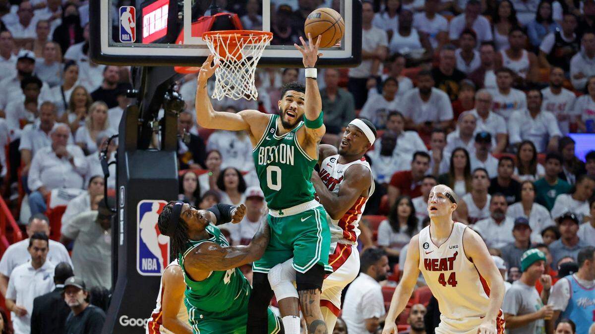 Miami Heat forward Jimmy Butler (22) defends against Boston Celtics forward Jayson Tatum (0) in the first quarter in Game 4 of the NBA Eastern Conference Finals at the Kaseya Center in Miami on Tuesday, May 23, 2023.
