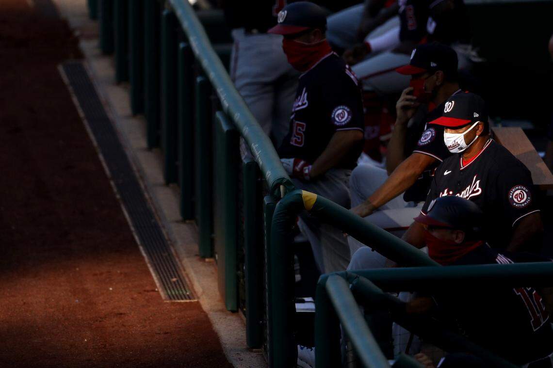 WASHINGTON, DC - JULY 29: Manager Dave Martinez of the Washington Nationals looks on from the dugout against the Toronto Blue Jays during the second inning at Nationals Park on July 29, 2020 in Washington, DC. The Blue Jays are hosting the Nationals for their 2020 home opener at Nationals Park due to the Covid-19 pandemic. The Blue Jays played as the home team due to their stadium situation and the Canadian governments policy on COVID-19. They will play a majority of their home games at Sahlen Field in Buffalo, New York. (Photo by Patrick Smith/Getty Images)