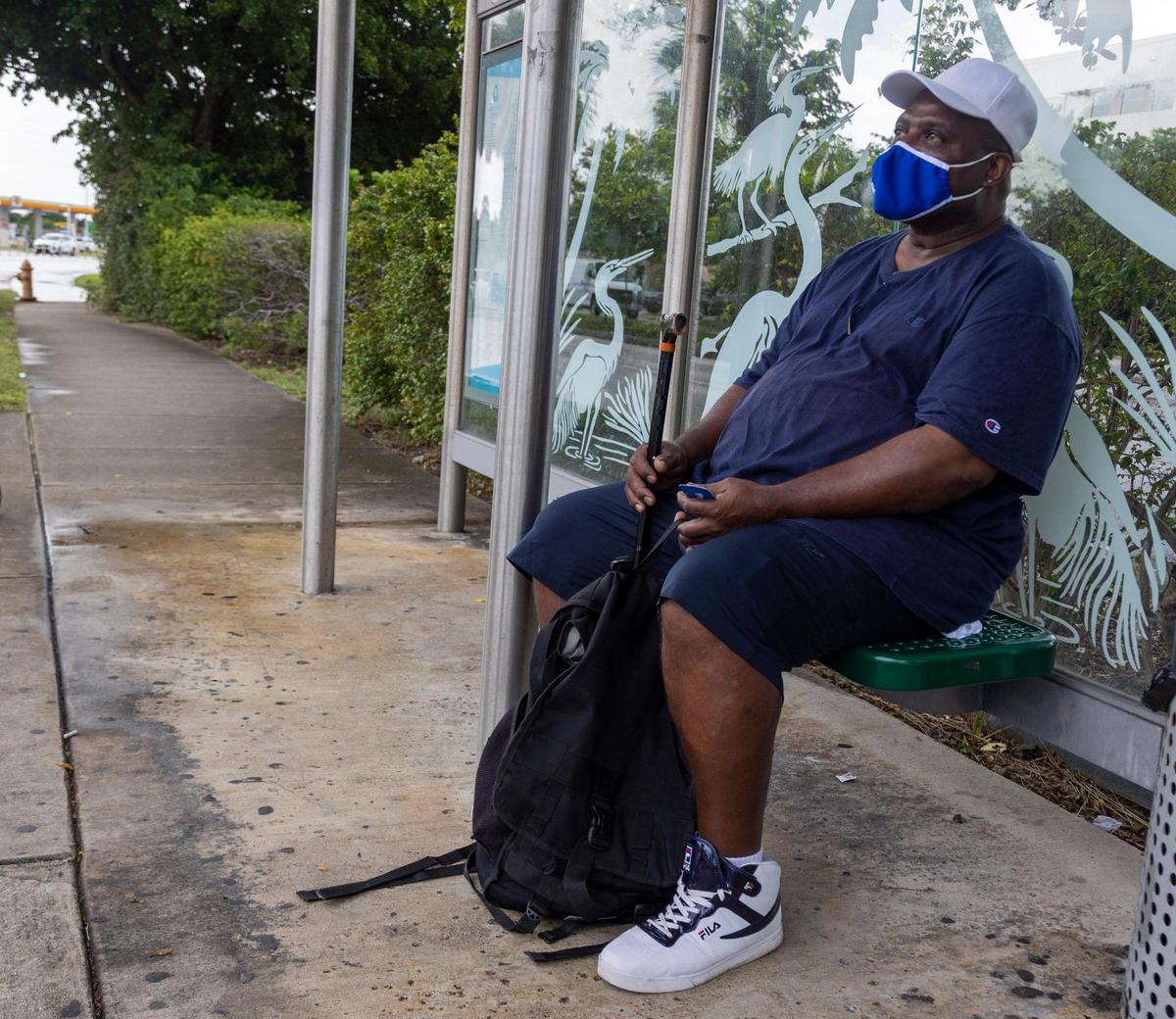 Morris Gamble waits for the 11 bus at the Mall of the Americas stop on NW 79th Avenue on Friday, October 1, 2021.
