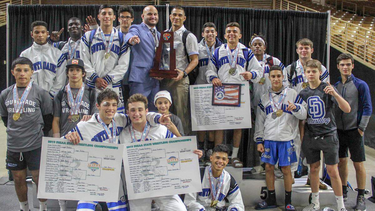 The South Dade Bucs wrestling team celebrates its sixth consecutive Class 3A state championship at Silver Spurs Arena on Saturday, March 9, 2019, in Kissimmee, Florida.