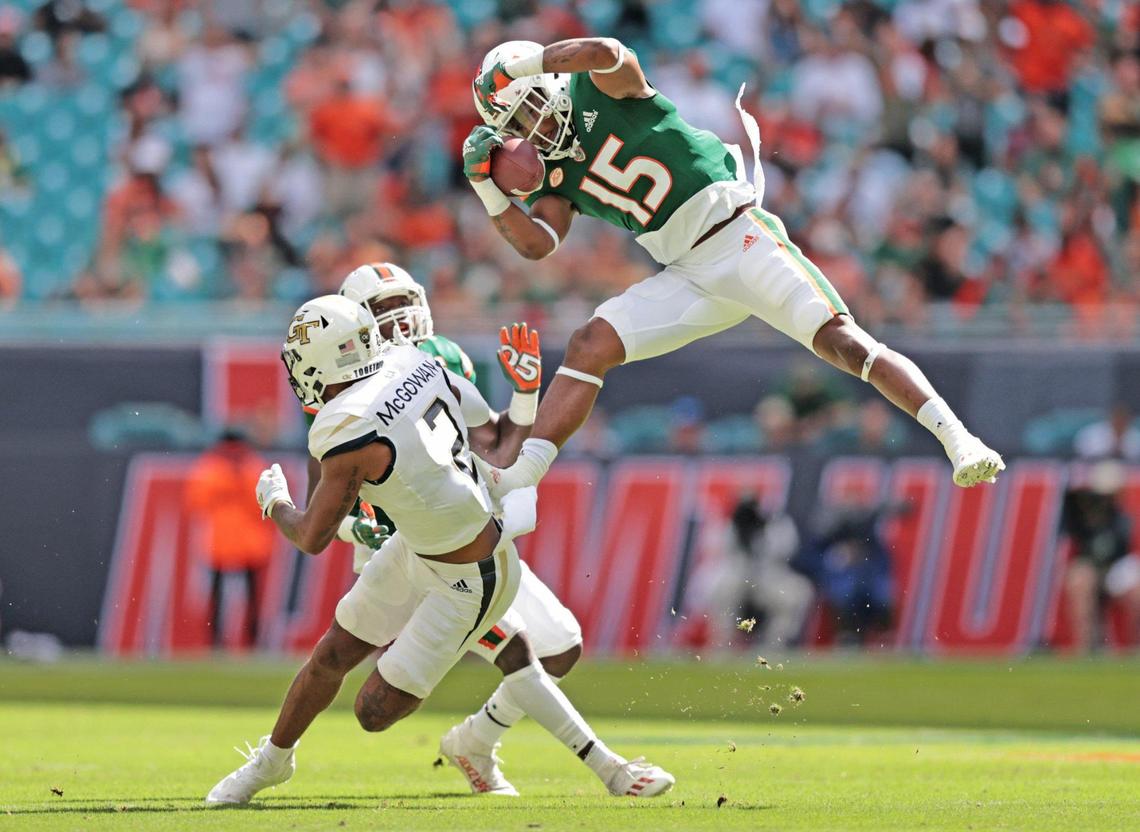 Miami Hurricanes safety Avantae Williams (15) intercepts the ball intended for Georgia Techs Tariq McGowan in the first half at Hard Rock Stadium in Miami Gardens on Saturday, November 6, 2021