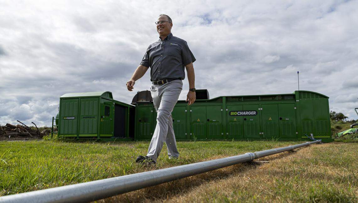 Mike Schmitt, director of sales and marketing with Air Burners, walks past a BioCharger unit on Thursday, Jan. 8, 2026, in Palm City, Fla. Air Burners is a manufacturer of air curtain burner systems, which provide a controlled way to dispose of wood and other vegetative waste.